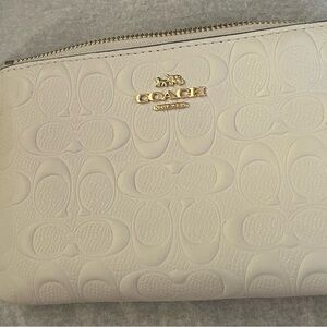 Coach Embossed Cream Wristlet